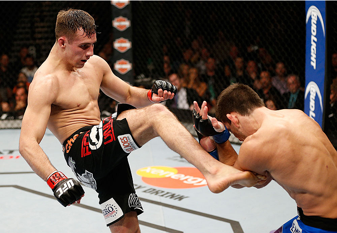 LAS VEGAS, NV - FEBRUARY 22:  (L-R) Rory MacDonald kicks Demian Maia in their welterweight bout during UFC 170 inside the Mandalay Bay Events Center on February 22, 2014 in Las Vegas, Nevada. (Photo by Josh Hedges/Zuffa LLC/Zuffa LLC via Getty Images) *** Local Caption *** Rory MacDonald; Demian Maia