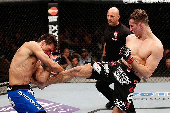 LAS VEGAS, NV - FEBRUARY 22:  (R-L) Rory MacDonald kicks Demian Maia in their welterweight bout during UFC 170 inside the Mandalay Bay Events Center on February 22, 2014 in Las Vegas, Nevada. (Photo by Josh Hedges/Zuffa LLC/Zuffa LLC via Getty Images) *** Local Caption *** Rory MacDonald; Demian Maia
