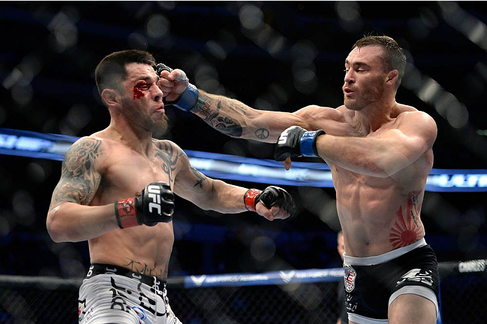 Robert Whiteford punches Daniel Pineda in their featherweight fight during the UFC 171 event inside American Airlines Center on March 15, 2014 in Dallas, Texas. (Photo by Jeff Bottari/Zuffa LLC)