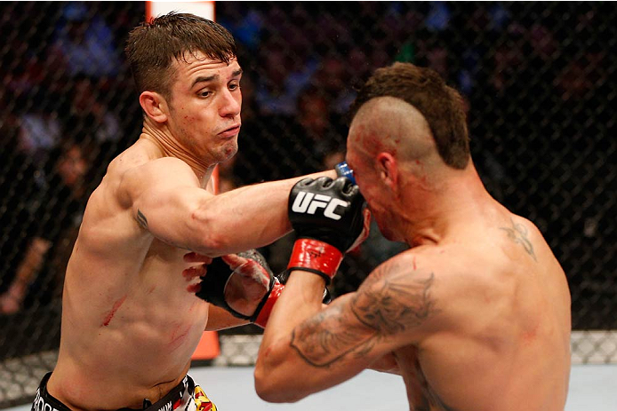 DALLAS, TX - MARCH 15:  (L-R) Myles Jury punches Diego Sanchez in their lightweight bout at UFC 171 inside American Airlines Center on March 15, 2014 in Dallas, Texas. (Photo by Josh Hedges/Zuffa LLC/Zuffa LLC via Getty Images)