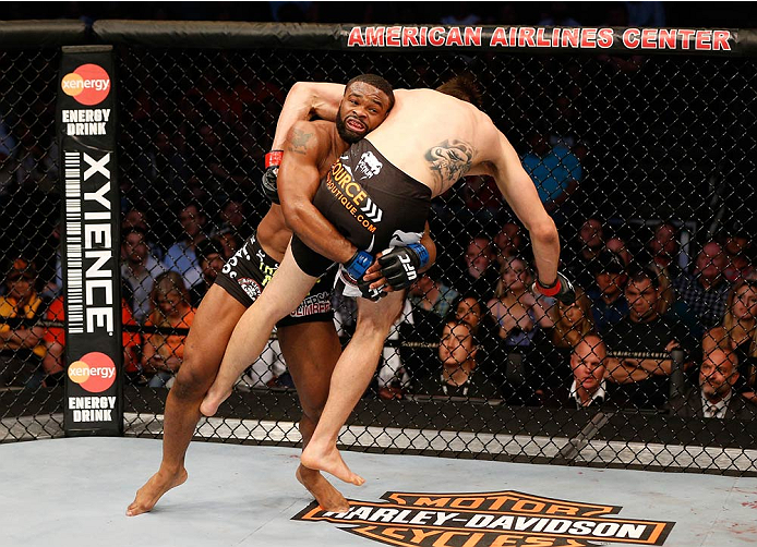 DALLAS, TX - MARCH 15:  (L-R) Tyron Woodley takes down Carlos Condit in their welterweight bout at UFC 171 inside American Airlines Center on March 15, 2014 in Dallas, Texas. (Photo by Josh Hedges/Zuffa LLC/Zuffa LLC via Getty Images)