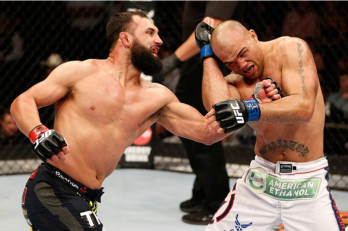 DALLAS, TX - MARCH 15:  (L-R) Johny Hendricks punches Robbie Lawler in their UFC welterweight championship bout at UFC 171 inside American Airlines Center on March 15, 2014 in Dallas, Texas. (Photo by Josh Hedges/Zuffa LLC/Zuffa LLC via Getty Images)