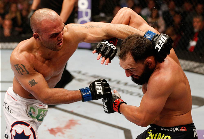 DALLAS, TX - MARCH 15:  (L-R) Robbie Lawler punches Johny Hendricks in their UFC welterweight championship bout at UFC 171 inside American Airlines Center on March 15, 2014 in Dallas, Texas. (Photo by Josh Hedges/Zuffa LLC/Zuffa LLC via Getty Images)