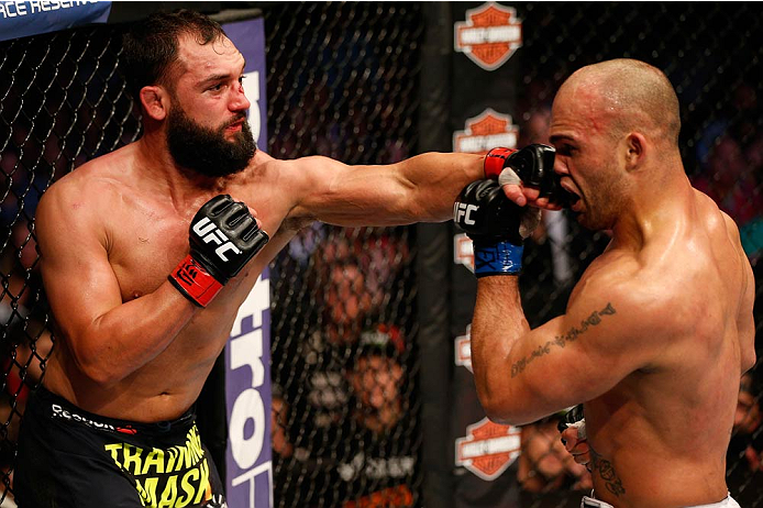 DALLAS, TX - MARCH 15:  (L-R) Johny Hendricks punches Robbie Lawler in their UFC welterweight championship bout at UFC 171 inside American Airlines Center on March 15, 2014 in Dallas, Texas. (Photo by Josh Hedges/Zuffa LLC/Zuffa LLC via Getty Images)
