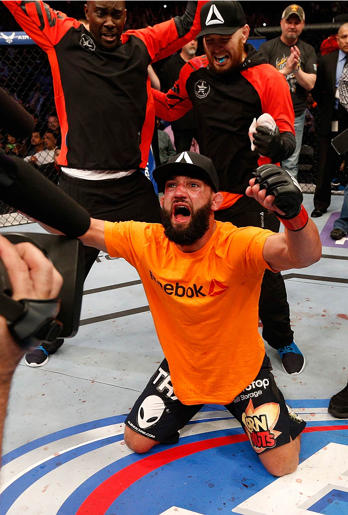 DALLAS, TX - MARCH 15:  Johny Hendricks reacts after defeating Robbie Lawler in their UFC welterweight championship bout at UFC 171 inside American Airlines Center on March 15, 2014 in Dallas, Texas. (Photo by Josh Hedges/Zuffa LLC/Zuffa LLC via Getty Images)