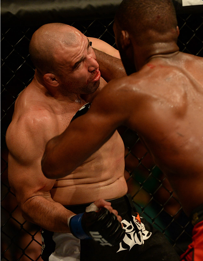 BALTIMORE, MD - APRIL 26:  (L-R) Glover Teixeira punches Jon "Bones" Jones in their light heavyweight championship bout during the UFC 172 event at the Baltimore Arena on April 26, 2014 in Baltimore, Maryland. (Photo by Patrick Smith/Zuffa LLC/Zuffa LLC via Getty Images)