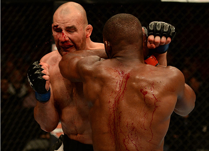 BALTIMORE, MD - APRIL 26:  (R-L) Jon "Bones" Jones elbows Glover Teixeira in their light heavyweight championship bout during the UFC 172 event at the Baltimore Arena on April 26, 2014 in Baltimore, Maryland. (Photo by Patrick Smith/Zuffa LLC/Zuffa LLC via Getty Images)