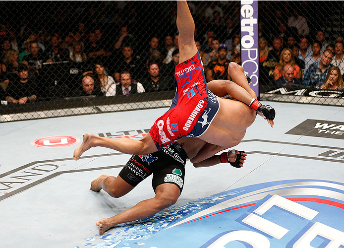 LAS VEGAS, NV - MAY 24:  Daniel Cormier (black trunks) slams Dan Henderson in their light heavyweight bout during the UFC 173 event at the MGM Grand Garden Arena on May 24, 2014 in Las Vegas, Nevada. (Photo by Josh Hedges/Zuffa LLC/Zuffa LLC via Getty Images)