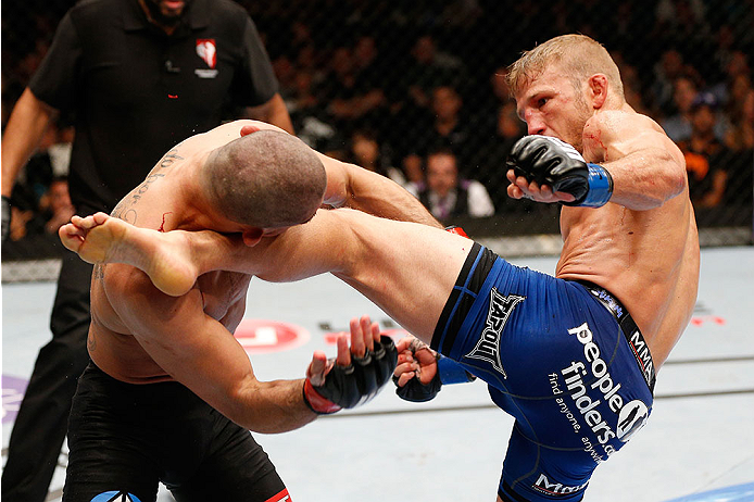 LAS VEGAS, NV - MAY 24:  (R-L) T.J. Dillashaw kicks Renan Barao in their bantamweight championship bout during the UFC 173 event at the MGM Grand Garden Arena on May 24, 2014 in Las Vegas, Nevada. (Photo by Josh Hedges/Zuffa LLC/Zuffa LLC via Getty Images)