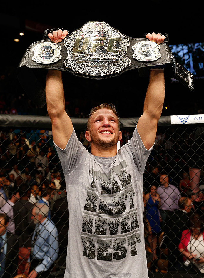 LAS VEGAS, NV - MAY 24:  T.J. Dillashaw celebrates his victory over Renan Barao in their bantamweight championship bout during the UFC 173 event at the MGM Grand Garden Arena on May 24, 2014 in Las Vegas, Nevada. (Photo by Josh Hedges/Zuffa LLC/Zuffa LLC via Getty Images)