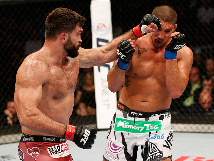 Andrei Arlovski punches Brendan Schaub in their heavyweight bout at Rogers Arena on June 14, 2014 in Vancouver, Canada. (Photo by Josh Hedges/Zuffa LLC)