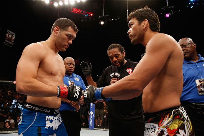 LAS VEGAS, NV - JULY 05:  (L-R) UFC middleweight champion Chris Weidman touches gloves with Lyoto Machida before their UFC middleweight championship fight at UFC 175 inside the Mandalay Bay Events Center on July 5, 2014 in Las Vegas, Nevada.  (Photo by Josh Hedges/Zuffa LLC/Zuffa LLC via Getty Images)