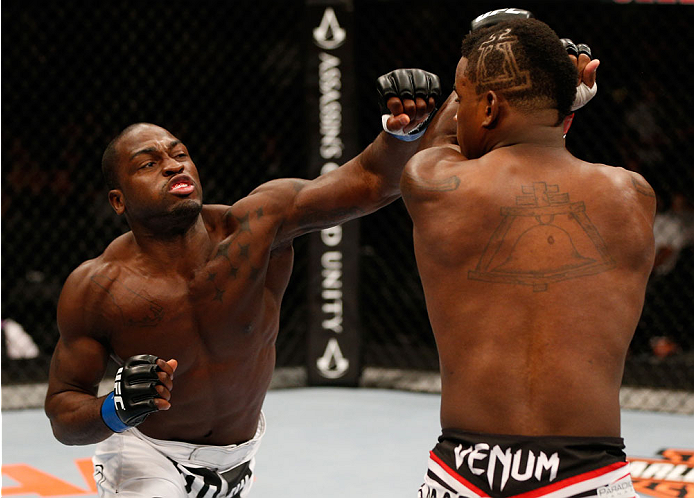 Derek Brunson punches <a href='../fighter/Lorenz-Larkin'>Lorenz Larkin</a> in their middleweight bout during the UFC 177 event at Sleep Train Arena on August 30, 2014 in Sacramento, California. (Photo by Josh Hedges/Zuffa LLC)