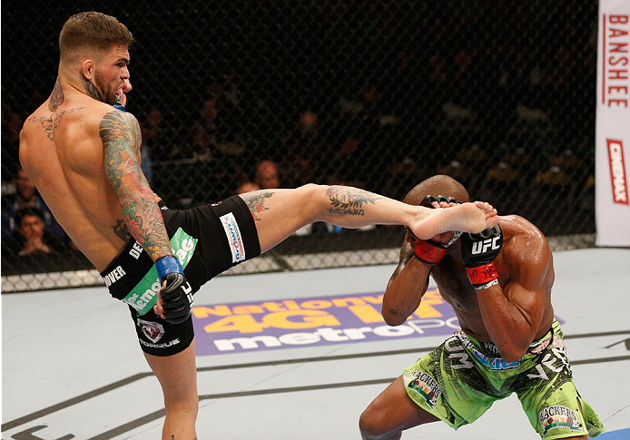 (L-R) Cody Garbrandt kickss Marcus Brimage in their bantamweight bout during the UFC 182 event at the MGM Grand Garden Arena on January 3, 2015 in Las Vegas, NV. (Photo by Josh Hedges/Zuffa LLC)