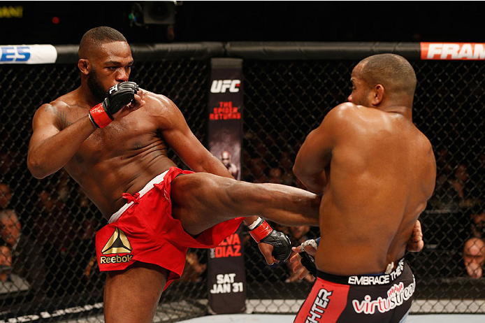 Jones lands a left body kick