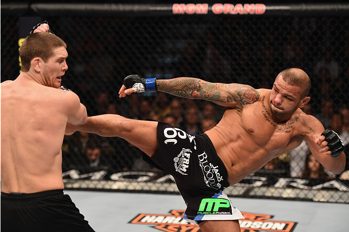 LAS VEGAS, NV - JAN. 31: (R-L) Thiago Alves kicks Jordan Mein in their welterweight bout during the UFC 183 event at the MGM Grand Garden Arena. (Photo by Josh Hedges/Zuffa LLC/Zuffa LLC)