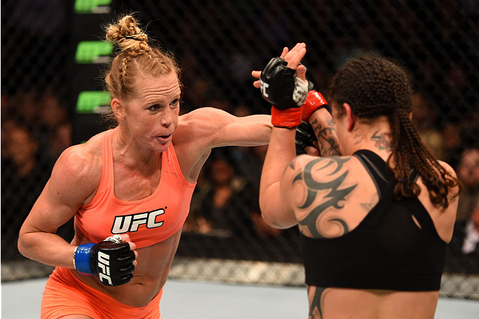 Holly Holm punches Raquel Pennington in their women's bantamweight bout during the UFC 184 event at Staples Center on February 28, 2015 in Los Angeles, CA. (Photo by Josh Hedges/Zuffa LLC)