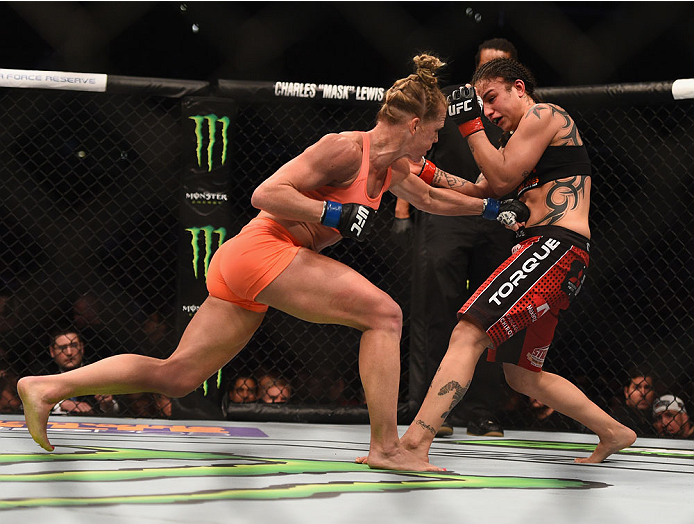 Holm punches Raquel Pennington in their women's bantamweight bout during the UFC 184 event February 28, 2015 in Los Angeles, CA. (Photo by Jeff Bottari/Zuffa LLC)