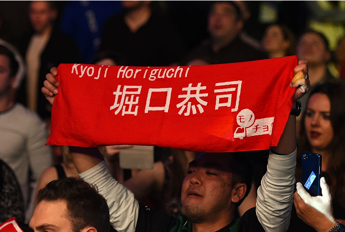 MONTREAL, QC - APRIL 25:   A fan holds a sign in support of Kyoji Horiguchi of Japan before his UFC flyweight championship bout against Demetrious Johnson during the UFC 186 event at the Bell Centre on April 25, 2015 in Montreal, Quebec, Canada. (Photo by Josh Hedges/Zuffa LLC/Zuffa LLC via Getty Images)