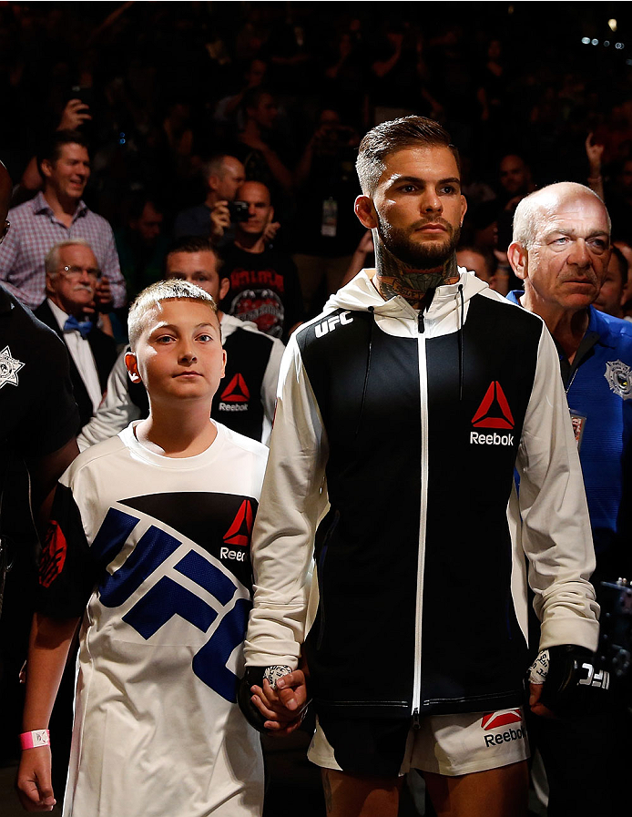 Cody Garbrandt and a young fan walk to the Octagon during the UFC 189 event inside MGM Grand Garden Arena on July 11, 2015 in Las Vegas, NV. (Photo by Christian Petersen/Zuffa LLC)