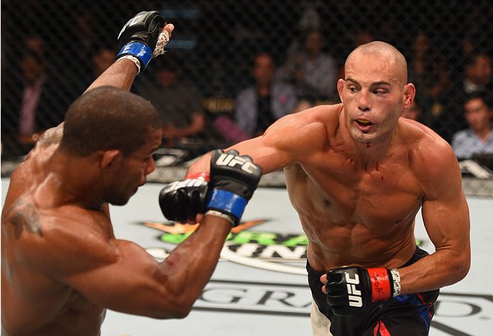 Mike Swick punches Alex Garcia in their welterweight fight during the UFC 189 event inside MGM Grand Garden Arena on July 11, 2015 in Las Vegas, Nevada. (Photo by Josh Hedges/Zuffa LLC)