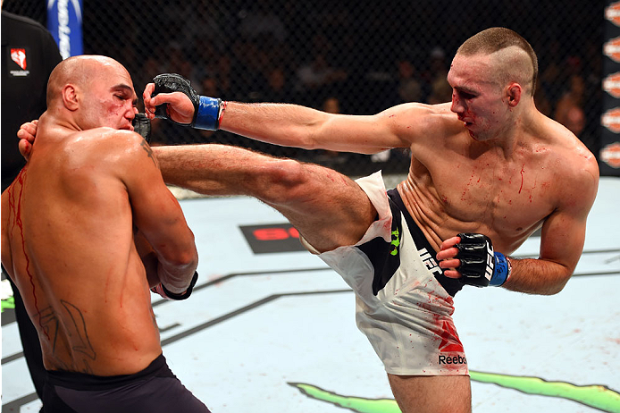Robbie Lawler kicks Rory MacDonald in their UFC welterweight title fight during the UFC 189 event inside MGM Grand Garden Arena on July 11, 2015 in Las Vegas, NV. (Photo by Josh Hedges/Zuffa LLC)