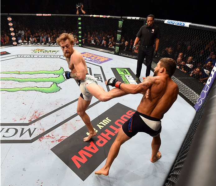Conor McGregor kicks Chad Mendes in their UFC interim featherweight title fight during the UFC 189 event inside MGM Grand Garden Arena on July 11, 2015 in Las Vegas, Nevada. (Photo by Josh Hedges/Zuffa LLC)