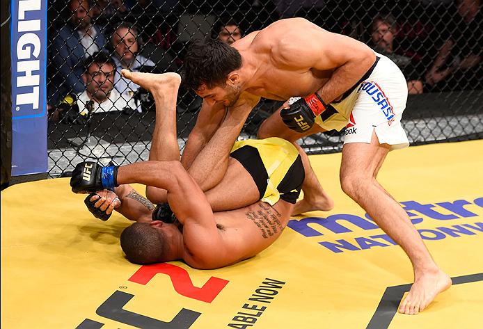 LAS VEGAS, NV - JULY 09: Gegard Mousasi of The Netherlands (top) punches Thiago Santos of Brazil in their middleweight bout during the UFC 200 event on July 9, 2016 at T-Mobile Arena in Las Vegas, Nevada. (Photo by Josh Hedges/Zuffa LLC/Zuffa LLC via Getty Images) *** Local Caption *** Gegard Mousasi; Thiago Santos