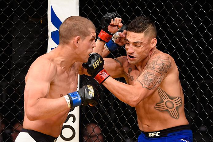<a href='../fighter/Joe-Lauzon'>Joe Lauzon</a> punches Diego Sanchez during their fight at UFC 200