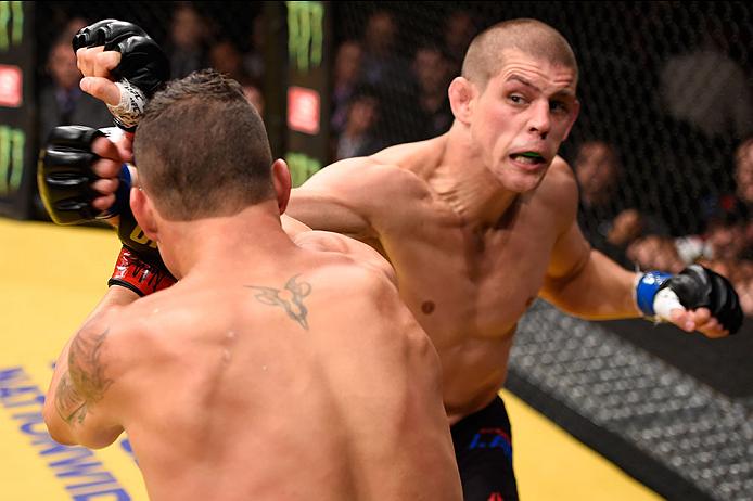 LAS VEGAS, NV - JULY 09: (R-L) Joe Lauzon punches Diego Sanchez in their lightweight bout during the UFC 200 event on July 9, 2016 at T-Mobile Arena in Las Vegas, Nevada. (Photo by Josh Hedges/Zuffa LLC/Zuffa LLC via Getty Images) *** Local Caption *** Diego Sanchez; Joe Lauzon