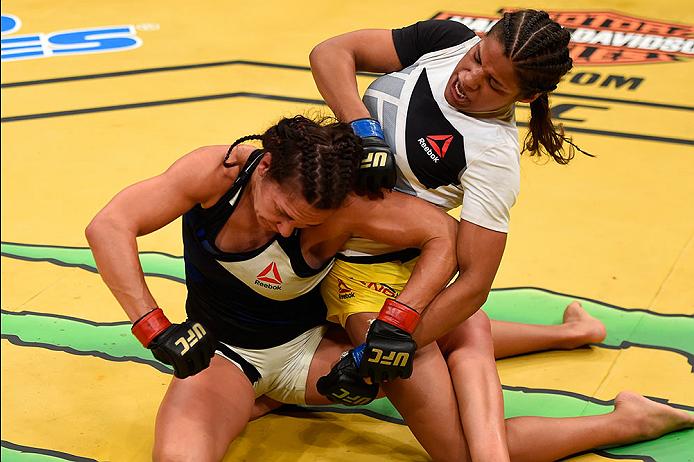 LAS VEGAS, NV - JULY 09: Julianna Pena (right) punches Cat Zingano in their women's bantamweight bout during the UFC 200 event on July 9, 2016 at T-Mobile Arena in Las Vegas, Nevada. (Photo by Josh Hedges/Zuffa LLC/Zuffa LLC via Getty Images) *** Local Caption *** Cat Zingano; Julianna Pena