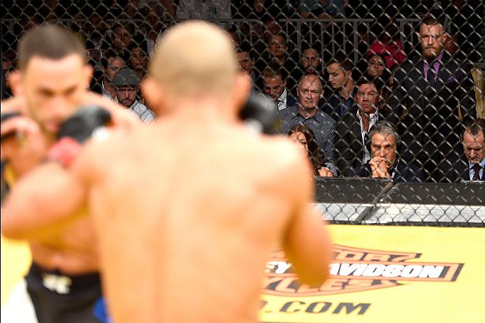 LAS VEGAS, NV - JULY 09: UFC featherweight champion Conor McGregor (right) watches Jose Aldo of Brazil vs Frankie Edgar in their UFC interim featherweight championship bout during the UFC 200 event on July 9, 2016 at T-Mobile Arena in Las Vegas, Nevada. (Photo by Josh Hedges/Zuffa LLC/Zuffa LLC via Getty Images) *** Local Caption *** Jose Aldo; Frankie Edgar; Conor McGregor