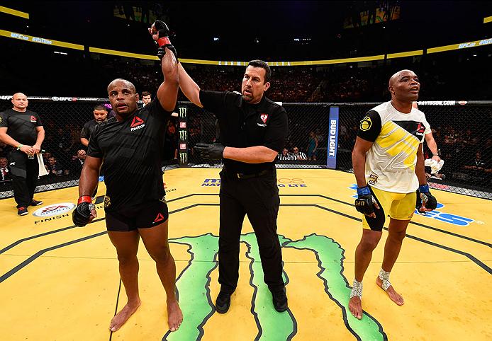 LAS VEGAS, NV - JULY 09: Daniel Cormier (left) reacts to his victory over Anderson Silva of Brazil (right) in their light heavyweight bout during the UFC 200 event on July 9, 2016 at T-Mobile Arena in Las Vegas, Nevada. (Photo by Josh Hedges/Zuffa LLC/Zuffa LLC via Getty Images) *** Local Caption *** Daniel Cormier; Anderson Silva