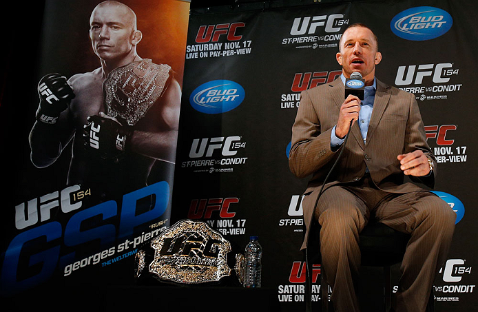 MONTREAL, CANADA - NOVEMBER 14:  Georges St-Pierre interacts with media and fans during the final pre-fight press conference ahead of UFC 154 at New City Gas on November 14, 2012 in Montreal, Quebec, Canada.  (Photo by Josh Hedges/Zuffa LLC/Zuffa LLC via Getty Images)