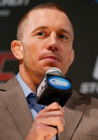 MONTREAL, CANADA - NOVEMBER 14:  Georges St-Pierre interacts with media and fans during the final pre-fight press conference ahead of UFC 154 at New City Gas on November 14, 2012 in Montreal, Quebec, Canada.  (Photo by Josh Hedges/Zuffa LLC/Zuffa LLC via Getty Images)