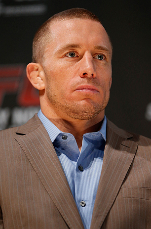 MONTREAL, CANADA - NOVEMBER 14:  Georges St-Pierre interacts with media and fans during the final pre-fight press conference ahead of UFC 154 at New City Gas on November 14, 2012 in Montreal, Quebec, Canada.  (Photo by Josh Hedges/Zuffa LLC/Zuffa LLC via Getty Images)