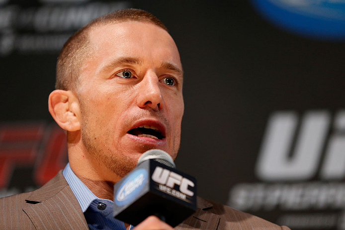 MONTREAL, CANADA - NOVEMBER 14:  Georges St-Pierre interacts with media and fans during the final pre-fight press conference ahead of UFC 154 at New City Gas on November 14, 2012 in Montreal, Quebec, Canada.  (Photo by Josh Hedges/Zuffa LLC/Zuffa LLC via Getty Images)