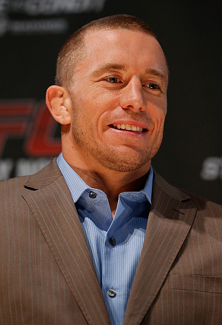 MONTREAL, CANADA - NOVEMBER 14:  Georges St-Pierre interacts with media and fans during the final pre-fight press conference ahead of UFC 154 at New City Gas on November 14, 2012 in Montreal, Quebec, Canada.  (Photo by Josh Hedges/Zuffa LLC/Zuffa LLC via Getty Images)