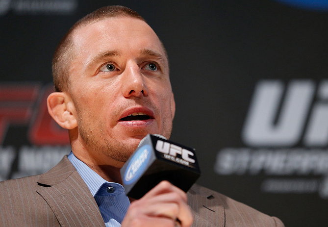 MONTREAL, CANADA - NOVEMBER 14:  Georges St-Pierre interacts with media and fans during the final pre-fight press conference ahead of UFC 154 at New City Gas on November 14, 2012 in Montreal, Quebec, Canada.  (Photo by Josh Hedges/Zuffa LLC/Zuffa LLC via Getty Images)