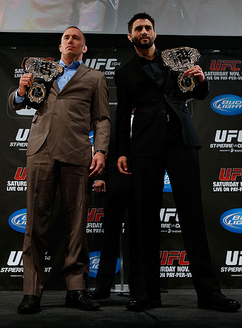 MONTREAL, CANADA - NOVEMBER 14:  (L-R) Opponents Georges St-Pierre and Carlos Condit pose for photos during the final pre-fight press conference ahead of UFC 154 at New City Gas on November 14, 2012 in Montreal, Quebec, Canada.  (Photo by Josh Hedges/Zuffa LLC/Zuffa LLC via Getty Images)