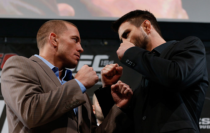 MONTREAL, CANADA - NOVEMBER 14:  (L-R) Opponents Georges St-Pierre and Carlos Condit face off during the final pre-fight press conference ahead of UFC 154 at New City Gas on November 14, 2012 in Montreal, Quebec, Canada.  (Photo by Josh Hedges/Zuffa LLC/Zuffa LLC via Getty Images)