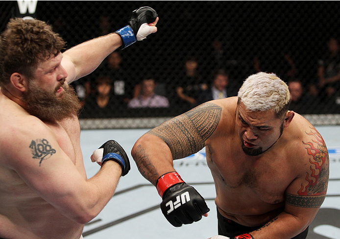 SAITAMA, JAPAN - SEPTEMBER 20:  Mark Hunt throws a punch at Roy Nelson in their heavyweight bout during the UFC Fight Night event inside the Saitama Arena on September 20, 2014 in Saitama, Japan. (Photo by Mitch Viquez/Zuffa LLC/Zuffa LLC via Getty Images)
