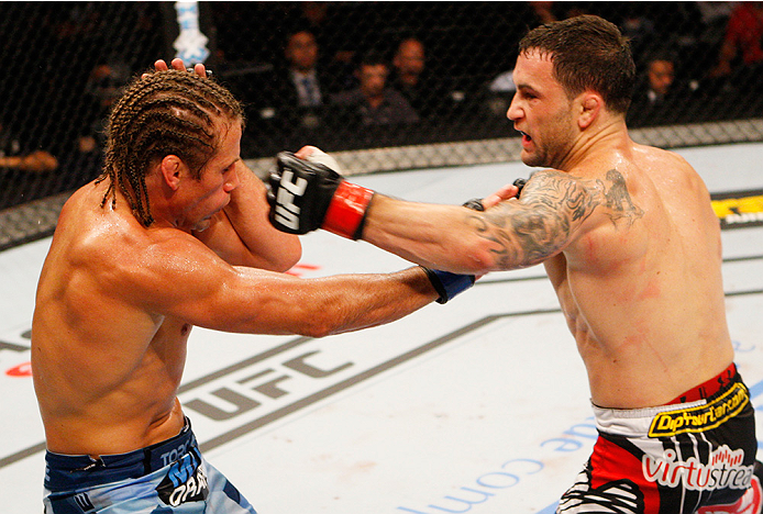 MANILA, PHILIPPINES - MAY 16: Frankie Edgar of the United States throws a punch at Uriah Faber of the United States in their featherweight fight during the UFC Fight Night event at the Mall of Asia Arena on May 16, 2015 in Manila, Philippines. (Photo by Mitch Viquez/Zuffa LLC/Zuffa LLC via Getty Images)