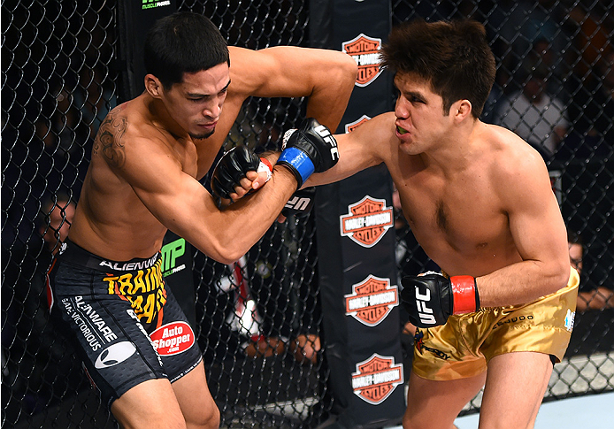 Cejudo throws a punch vs. Dustin Kimura