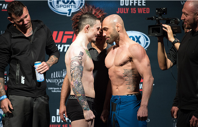 (L-R) Jorgensen and Gamburyan step on the scale during the UFC weigh-in on July 14, 2015 in San Diego, CA. (Photo by Jeff Bottari/Zuffa LLC)