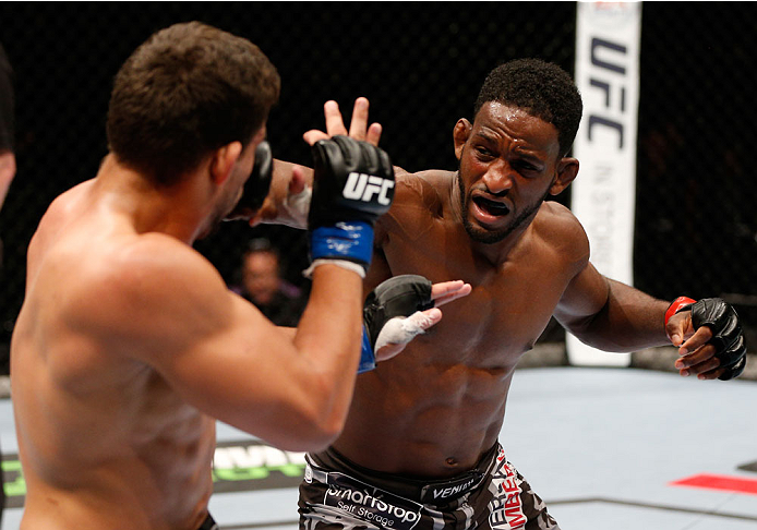 Neil Magny punches Rodrigo de Lima in their welterweight fight during the UFC Fight Night event on June 28, 2014 in Auckland, NZ. (Photo by Josh Hedges/Zuffa LLC)