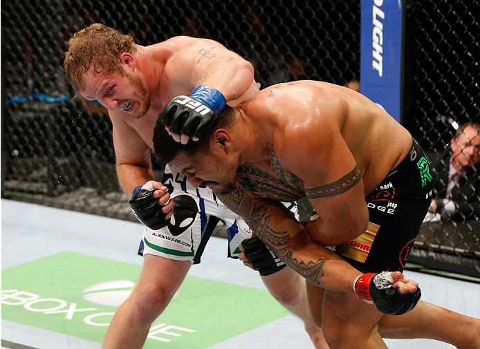 Jared Rosholt and Soa Palelei trade punches in their heavyweight fight during the UFC Fight Night event at Vector Arena on June 28, 2014 in Auckland, NZ. (Photo by Josh Hedges/Zuffa LLC)