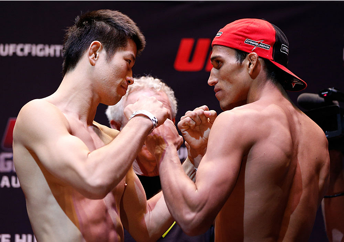 AUCKLAND, NEW ZEALAND - JUNE 27:  (L-R) Opponents Hatsu Hioki of Japan and Charles Oliveira of Brazil during the UFC weigh-in at Vector Arena on June 27, 2014 in Auckland, New Zealand.  (Photo by Josh Hedges/Zuffa LLC/Zuffa LLC via Getty Images)