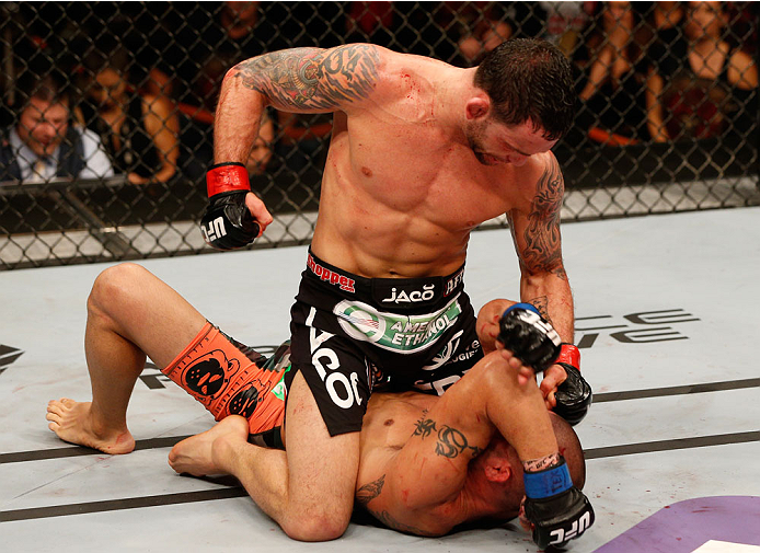 Edgar (top) tries to finish Swanson via ground-and-pound