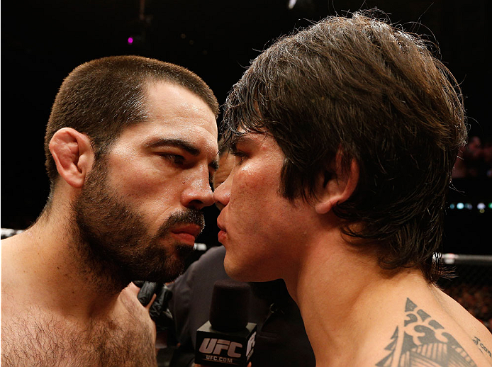 Matt Brown (left) and Silva (right) inside the Octagon